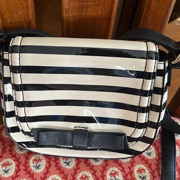 kate spade Handbags - Kate Spade mini crossbody in black and cream patent leather MSRP 228